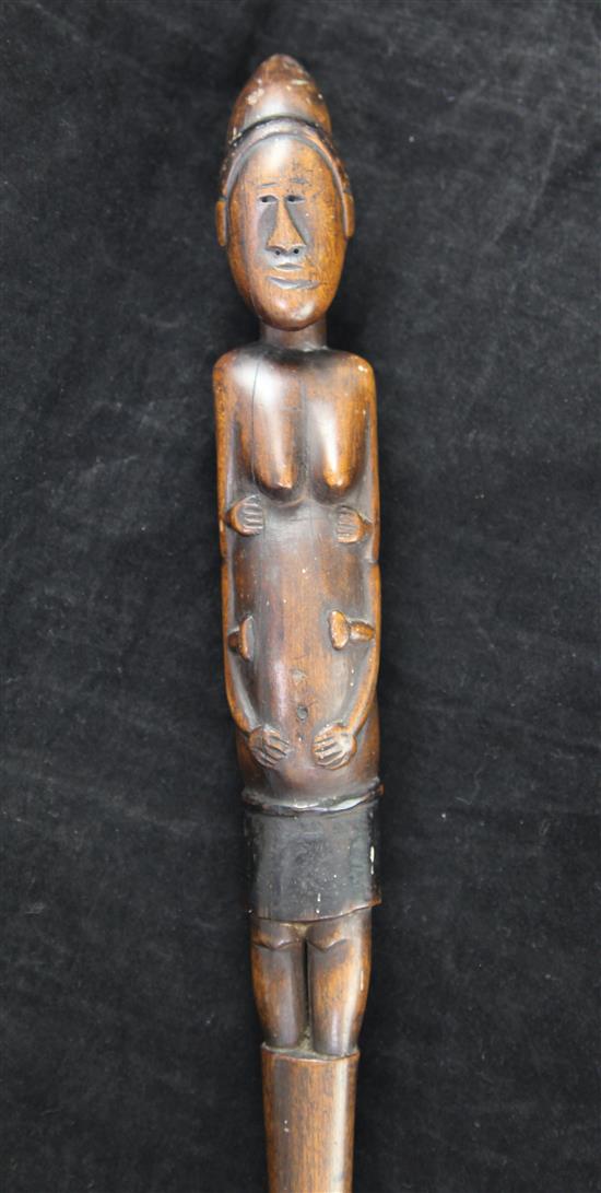 An early 20th century African carved wood walking stick, 37in.